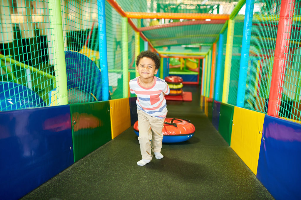 Kids happily playing at indoor playcenter